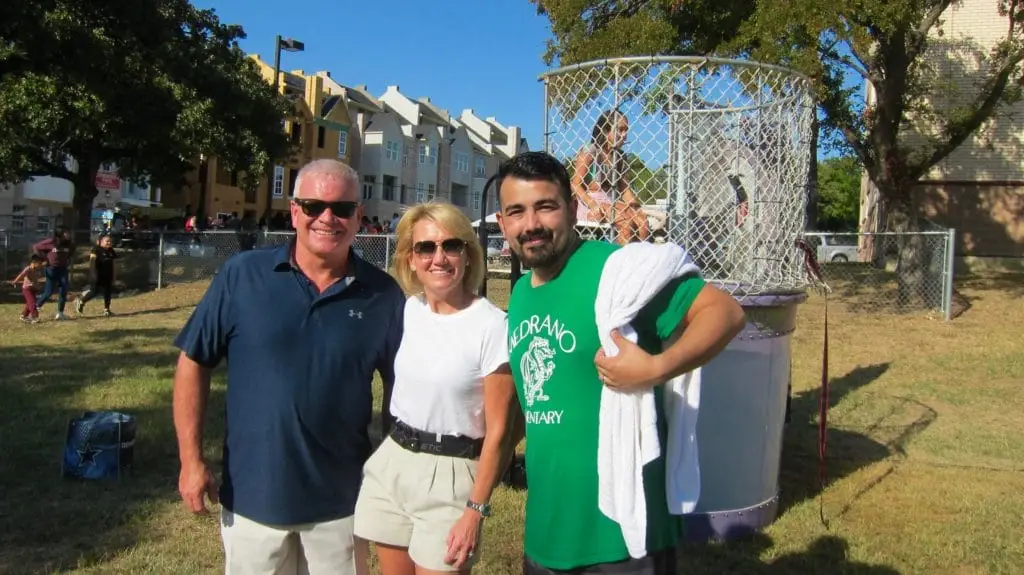 L to R Todd Tracy and Amanda Tracy and Mario Mondragon Principal Esperanta Hope Medrano Elementary School at Carnival Sponsored by The Tracy Law Firm