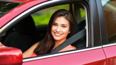 Brunette Teen in Red Car.